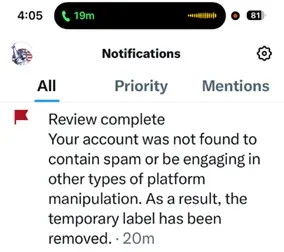 Notification from X: review complete, the temporary label has been removed